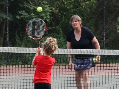 kid playing tennis