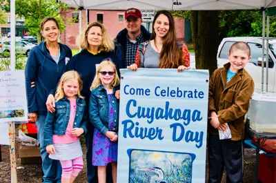 People standing with Cuyahoga River Day sign