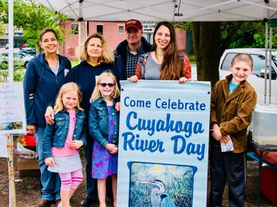 People standing with Cuyahoga River Day sign