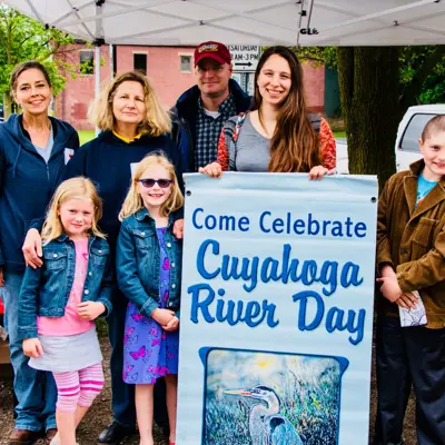 People standing with Cuyahoga River Day sign