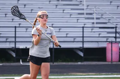 kid playing lacrosse